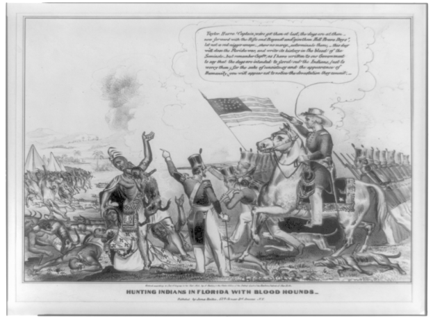 Schwarzes und weißes Foto einer Gruppe von Menschen, einige zu Pferde, mit einer Flagge im Hintergrund und Text, der unten 'Indianerjagd in Florida mit Bluthunden' lautet.