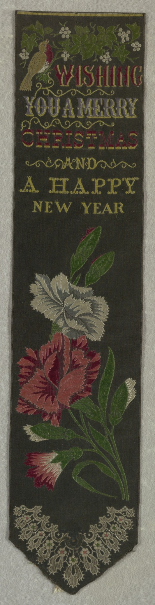 Schwarze Flagge mit roter und wei├čer Stickerei in Form einer Blume und dem Text 'Frohe Weihnachten und ein glückliches neues Jahr', verziert mit bunten Blumen und Bl├Ąttern.