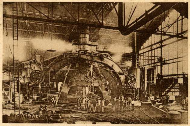 Ein Schwarz-Weiß-Foto einer Fabrikszene in der Cadillac Steel Works, das Menschen bei der Bedienung einer großen Maschine zeigt, umgeben von Leitern und Stangen.
