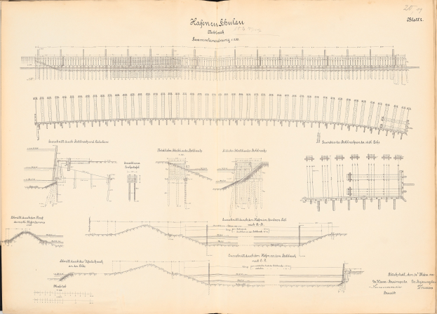 Ein aufgeschlagenes Buch mit detaillierten Zeichnungen und Text, einschließlich einer Illustration einer Eisenbahnschiene, das einen Überblick über ein Eisenbahnsystem bietet.